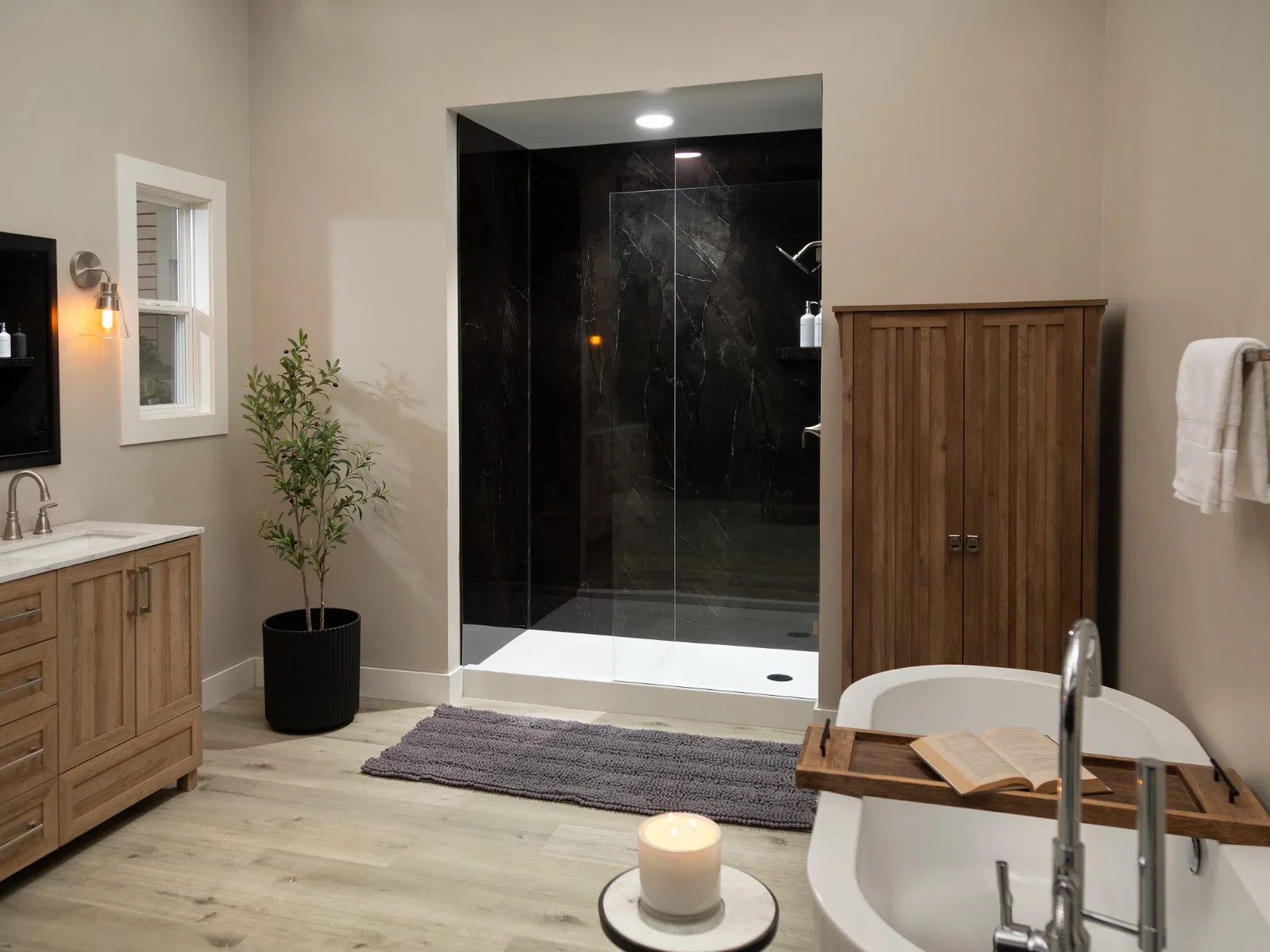 Modern bathroom with wood vanity, potted plant, glass shower, freestanding tub with book tray, and wooden storage cabinet.
