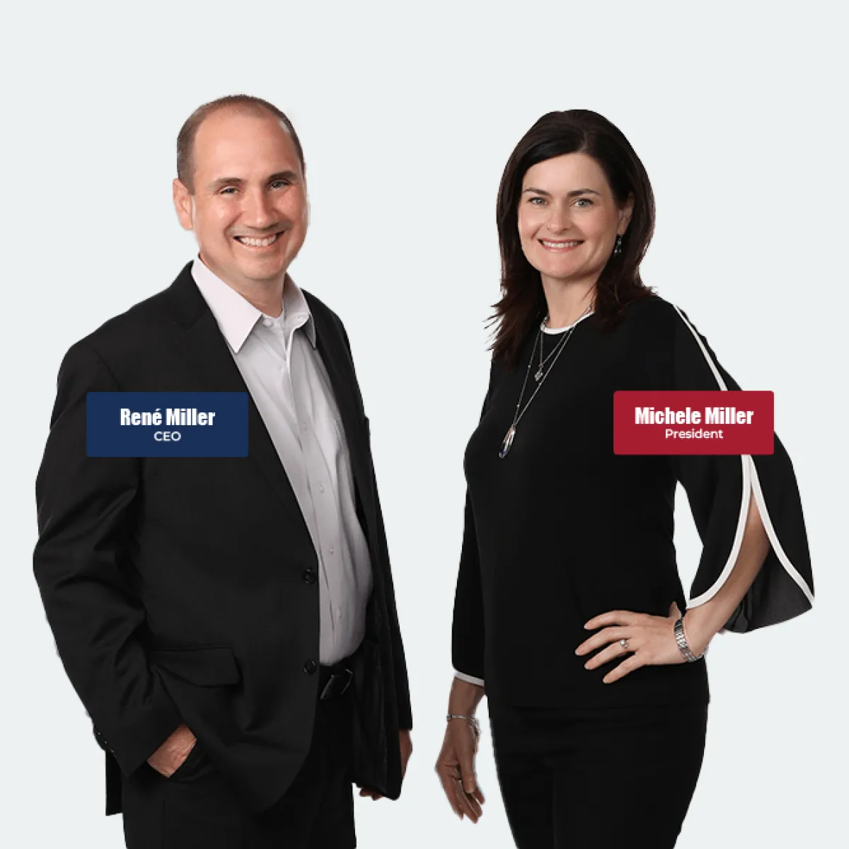 Professional portrait of René Miller CEO and Michele Miller President standing and smiling in business attire.