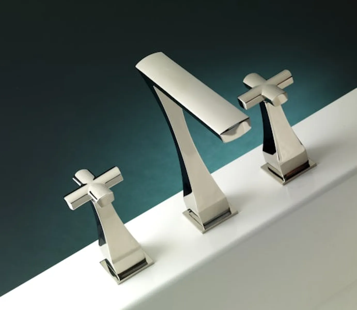 Modern chrome bathroom faucet set with cross handles mounted on a white bathtub edge.