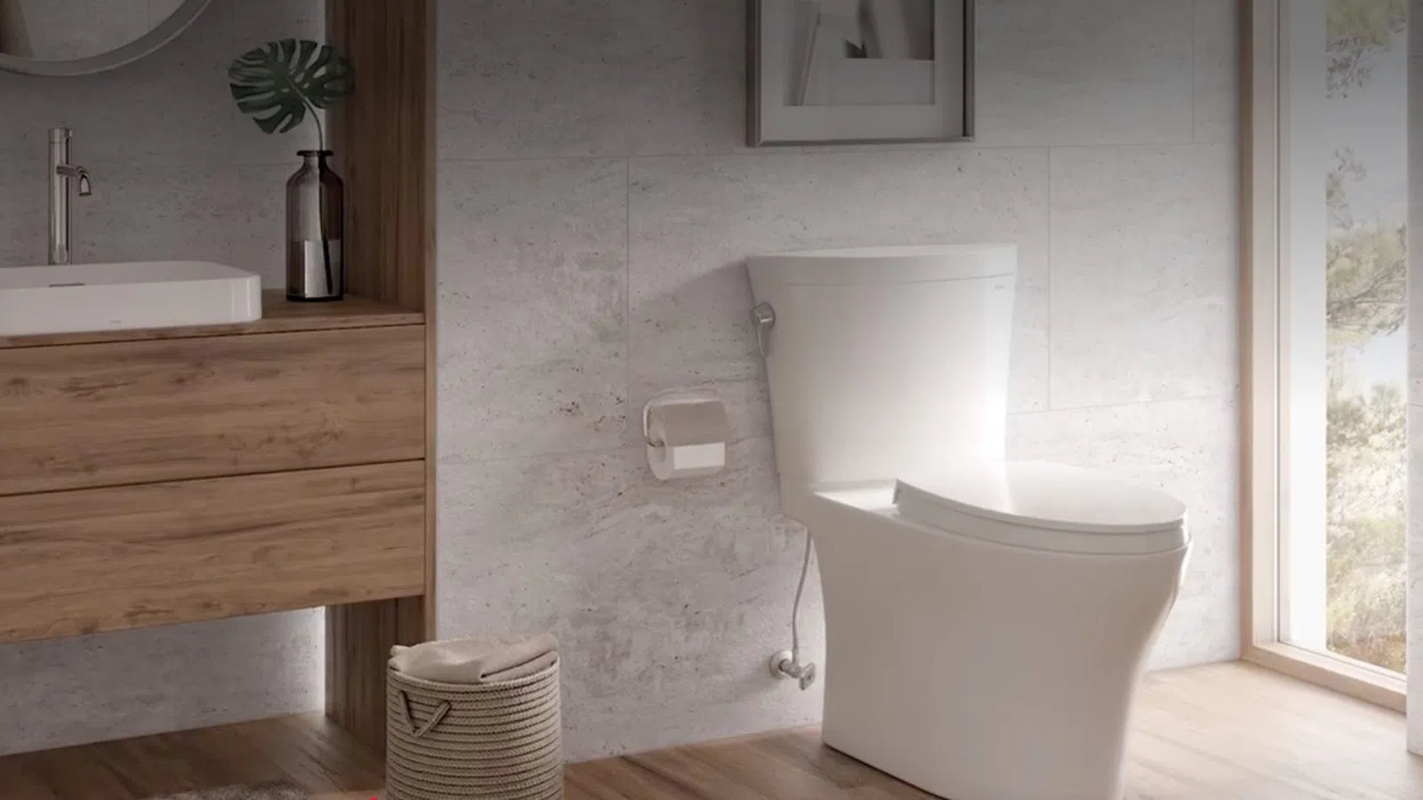 Modern bathroom with white toilet, wooden vanity, woven basket, and natural light from a window