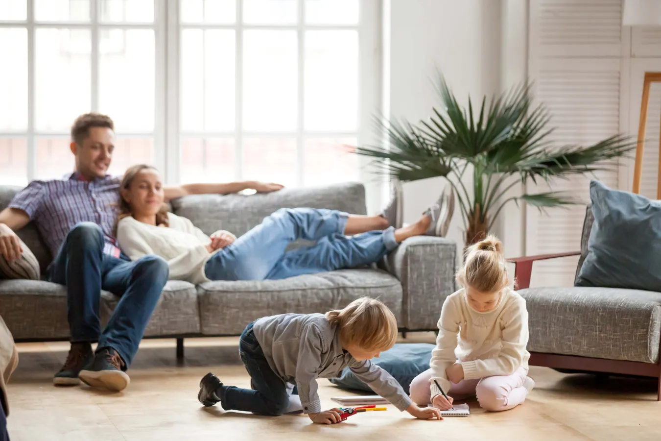 a family sitting on the floor