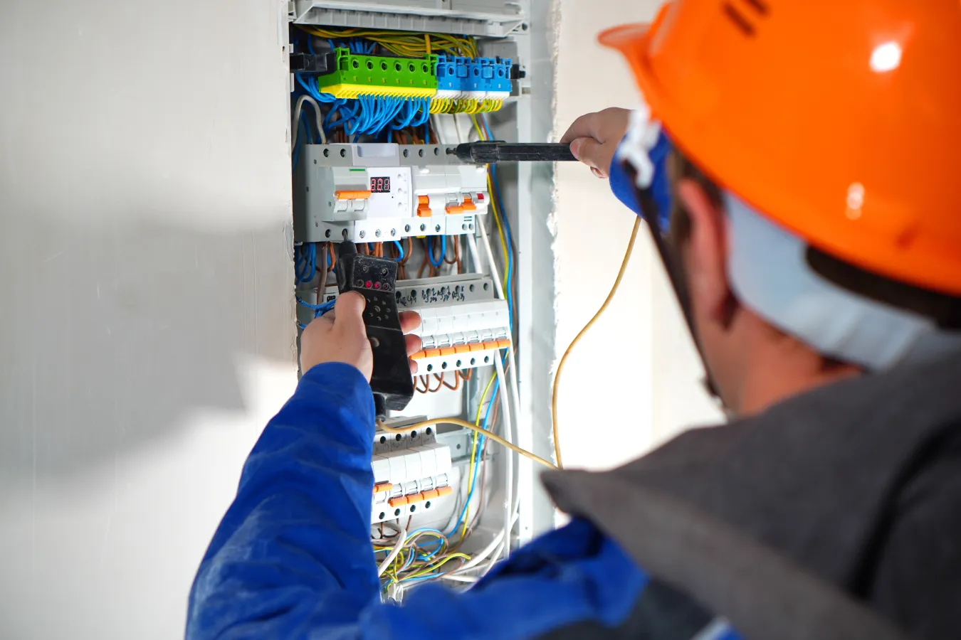 technician working on electric panel