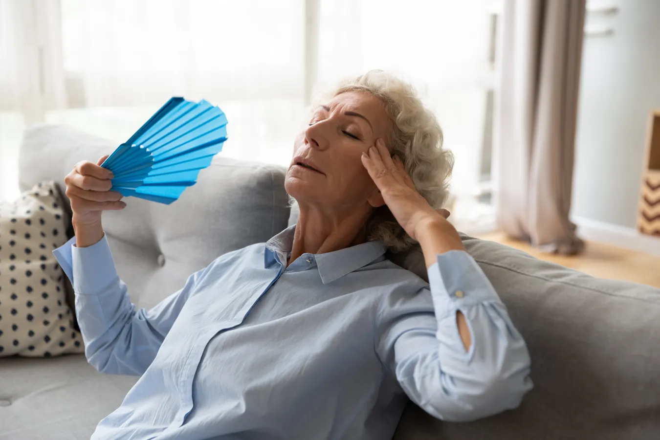 woman fanning herself