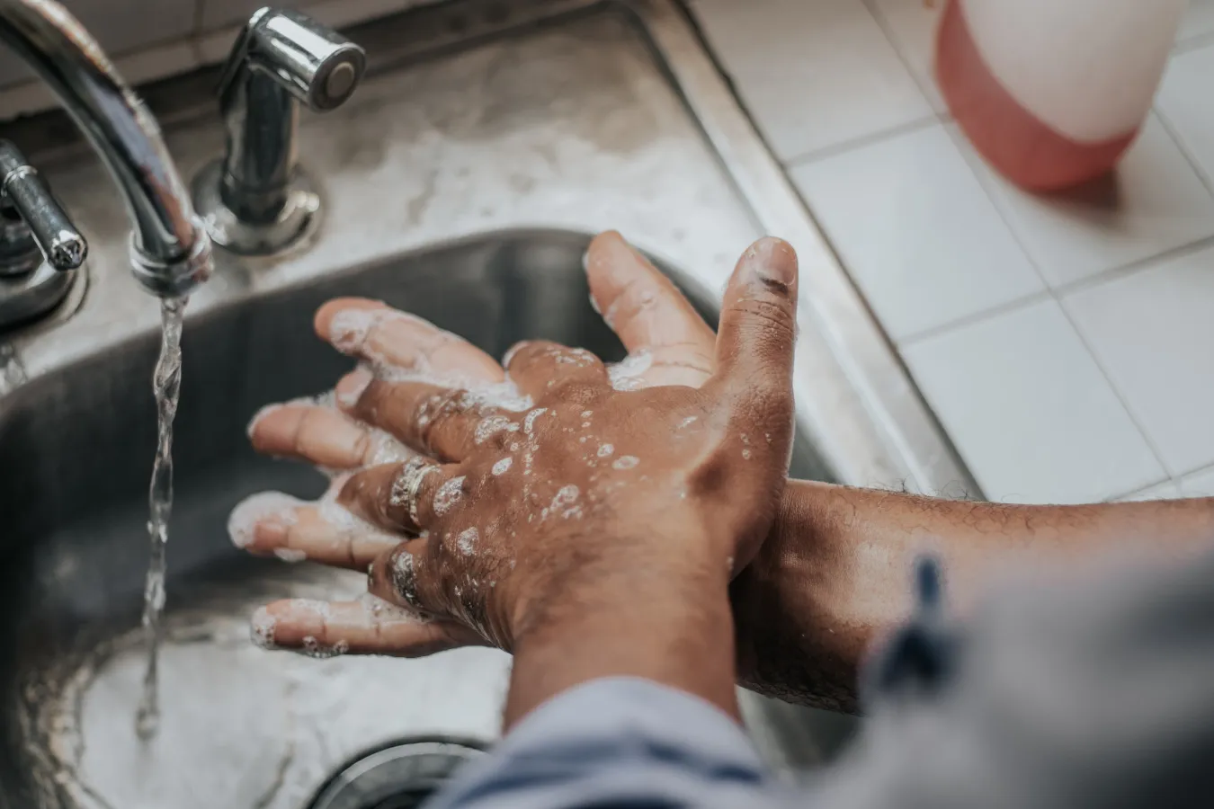 a hand holding a spoon