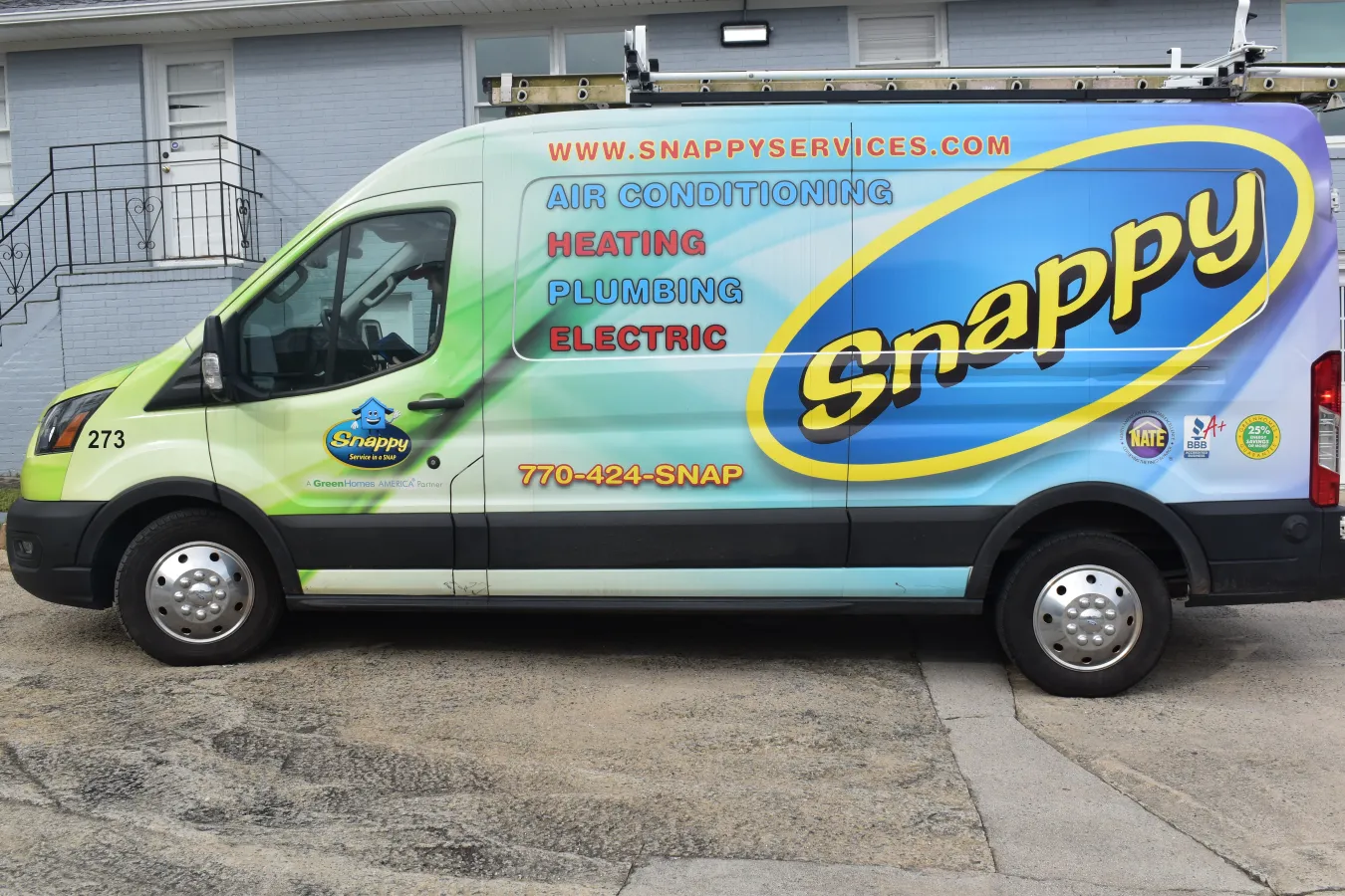 a van parked in front of a building