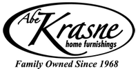 Black and white logo featuring the word Krasne in cursive inside an oval shape