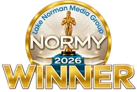 Gold and blue 2026 Normy Winner emblem with a statuette and Lake Norman Media Group text