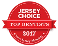Red circular badge reading Jersey Choice Top Dentists 2017 awarded by New Jersey Monthly magazine