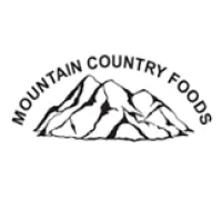 Black and white logo of Mountain Country Foods featuring stylized mountain peaks with text above them.