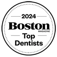 2024 Boston Magazine Top Dentists circular badge award logo in black and white design