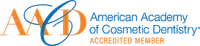 Logo of American Academy of Cosmetic Dentistry Accredited Member with blue and orange text and a stylized orbit design