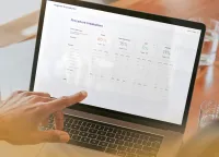 Person pointing at a laptop screen displaying a detailed hygiene procedure breakdown dashboard with percentages and targets.
