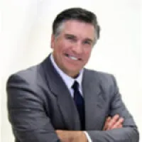 a man in a suit smiling