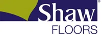 Shaw Floors logo featuring green and blue design elements with bold white text on a dark background.