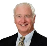 a man in a suit smiling