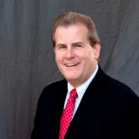 Rick Trainor in a suit and tie