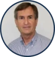 Portrait of a middle-aged man with brown hair wearing a striped button-up shirt against a white background.