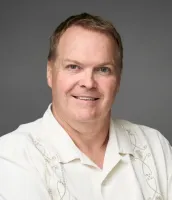 a man wearing a white shirt