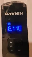 Navien device screen displaying error code E.110 with blue digital text and control buttons.