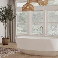 Bright modern bathroom with freestanding white tub, large windows, wooden floor, woven light fixtures, and a potted plant