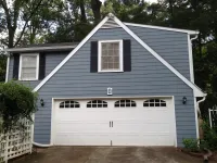 a white house with a garage