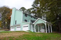 a green house with white doors
