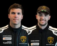 Two race car drivers in black Lamborghini racing suits with sponsor logos on a black background.