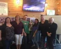 a group of people standing in a room
