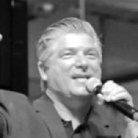 a man singing into a microphone