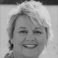 a woman smiling for the camera