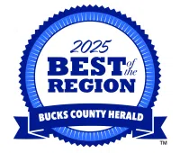 2025 Best of the Region award badge by Bucks County Herald with blue ribbon and circular design