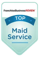 Franchise Business Review Top Maid Service award badge in blue and white with red text