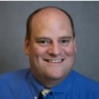 a man smiling for the camera