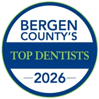 Circular badge with overlaid text reading Bergen County's Top Dentists 2026 on transparent background
