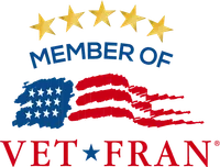 VetFran member logo featuring five stars above an American flag design and bold red and blue text.