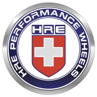 Circular HRE Performance Wheels logo with blue outer ring and red shield featuring white cross and HRE letters.