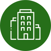 White building icon with multiple windows on a green circular background representing urban architecture.