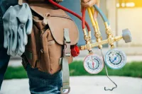 An HVAC Service Technicians gauges
