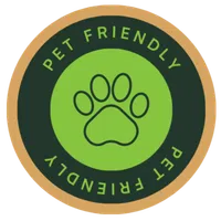 Round pet friendly badge with green paw print icon and text on dark and tan circular background