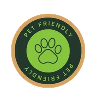 Round pet friendly badge with a green paw print in the center and text on a dark green background