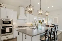 a kitchen with white cabinets