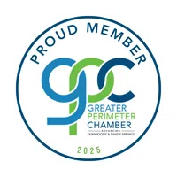 Greater Perimeter Chamber 2025 proud member logo featuring blue and green intertwined letters in a circular design.