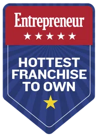 Entrepreneur badge designating hottest franchise to own with stars and bold text on blue and red background.