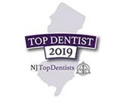 NJ Top Dentist 2019 badge featuring New Jersey state silhouette and award text in purple and black.
