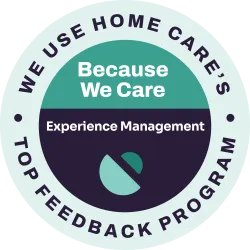 Badge displaying We Use Home Care's Top Feedback Program with Because We Care Experience Management text and logo.