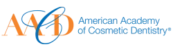 Logo of American Academy of Cosmetic Dentistry with stylized orange and blue text and graphic elements.