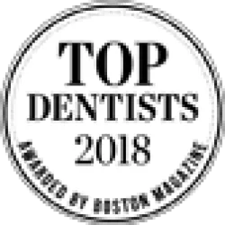 2018 Top Dentists award badge in a circular black and white design