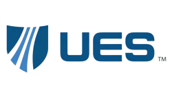 UES logo with a blue shield emblem and bold blue letters on a transparent background