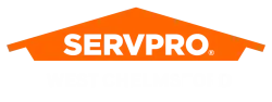 SERVPRO West Chelmsford logo with orange house shape and bold black and white text on black background