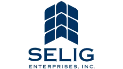 Selig Enterprises Inc. logo with blue stylized geometric shapes above bold text on a transparent background.